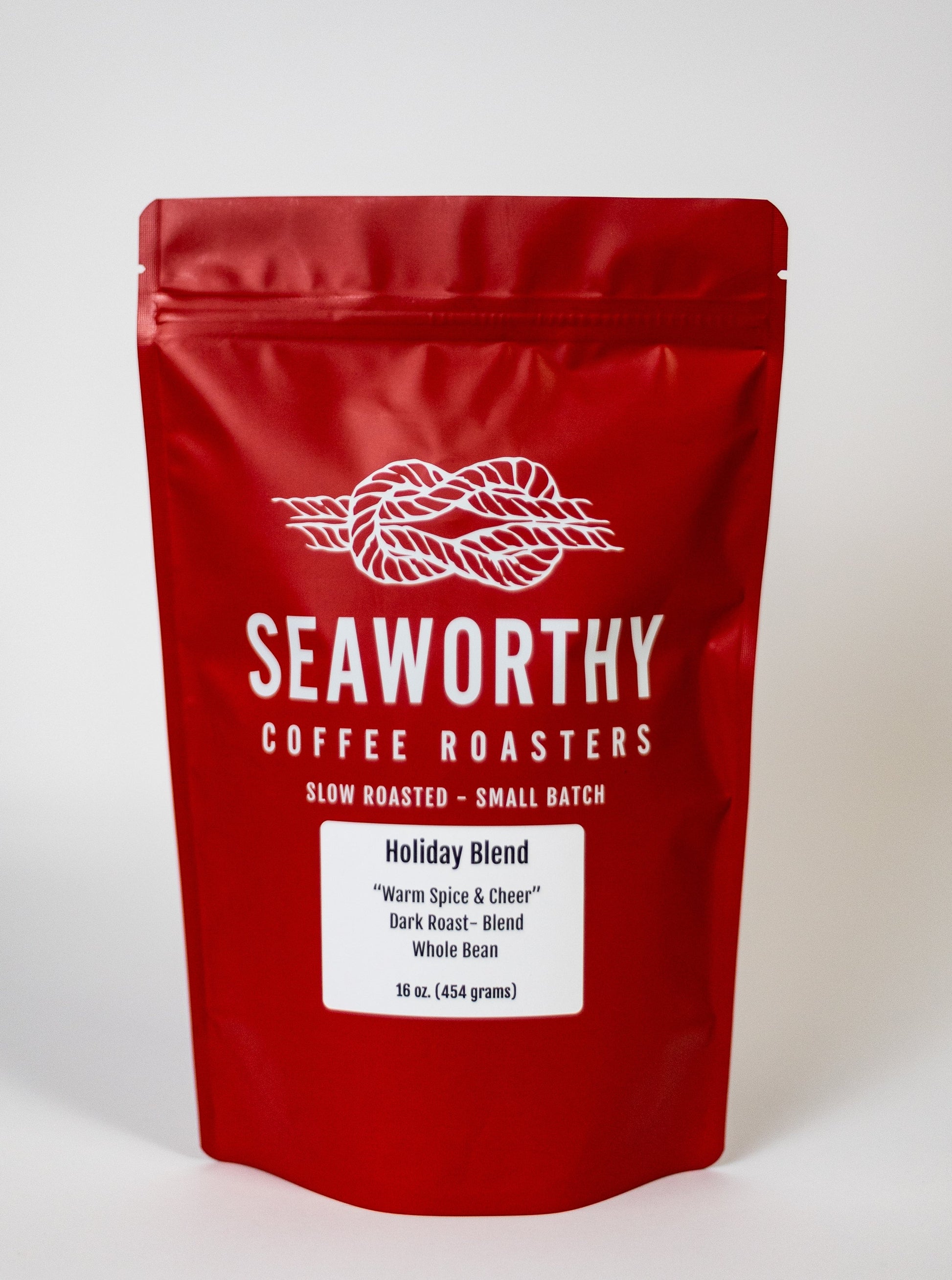 Seaworthy slow roasted, small batch, low acid coffee. 1 pound bag of Holiday Blend dark roast specialty coffee.  Christmas Blend.  Holiday Blend.  Red bag.